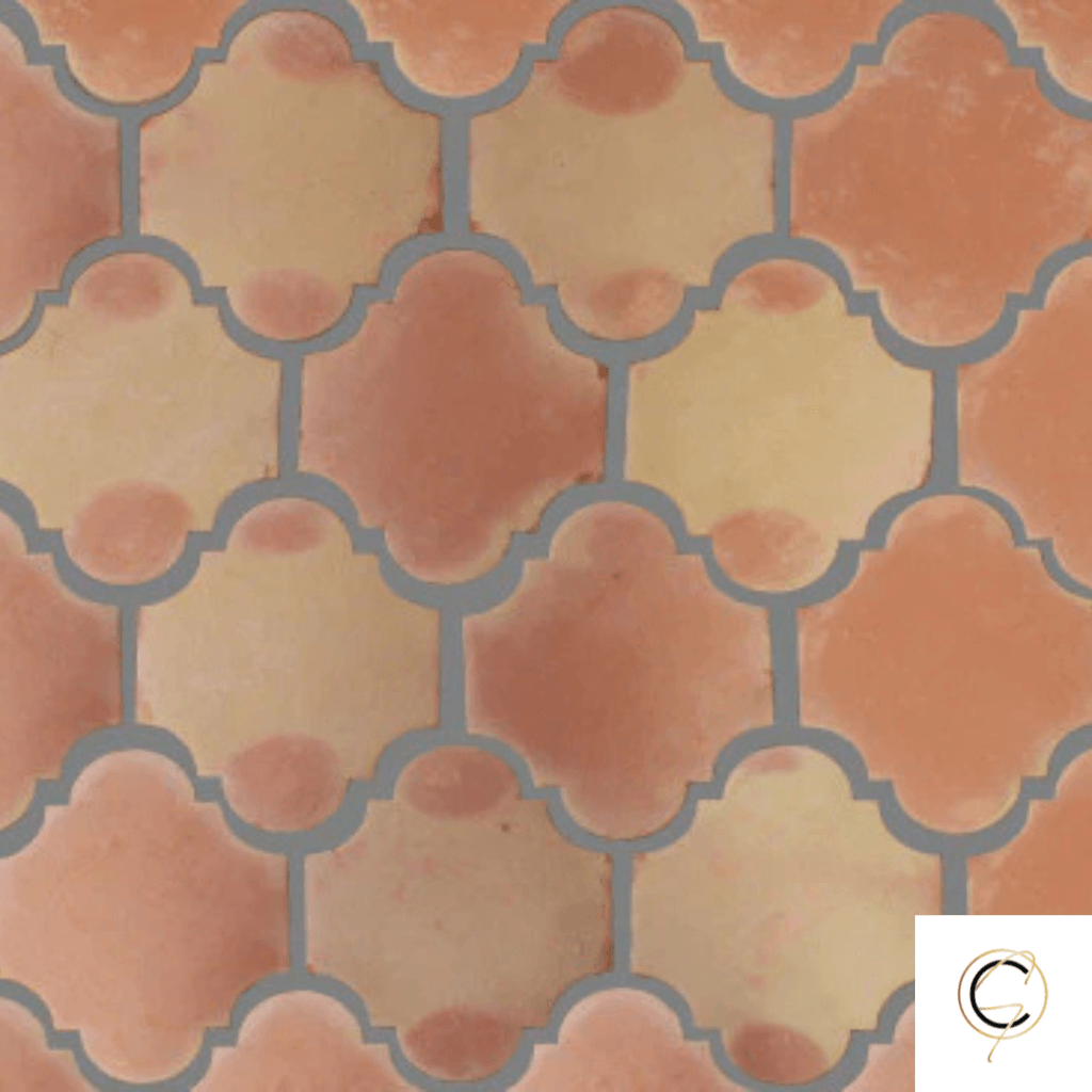 Rustic handmade terracotta floor tile in warm golden-red tones with natural surface variation