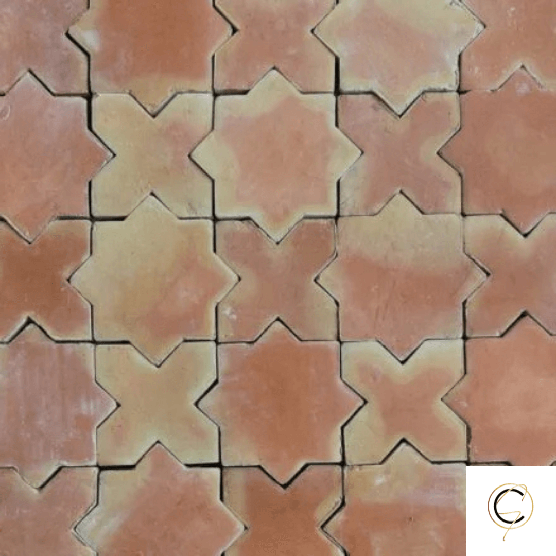 Rustic handmade terracotta floor tile in warm golden-red tones with natural surface variation