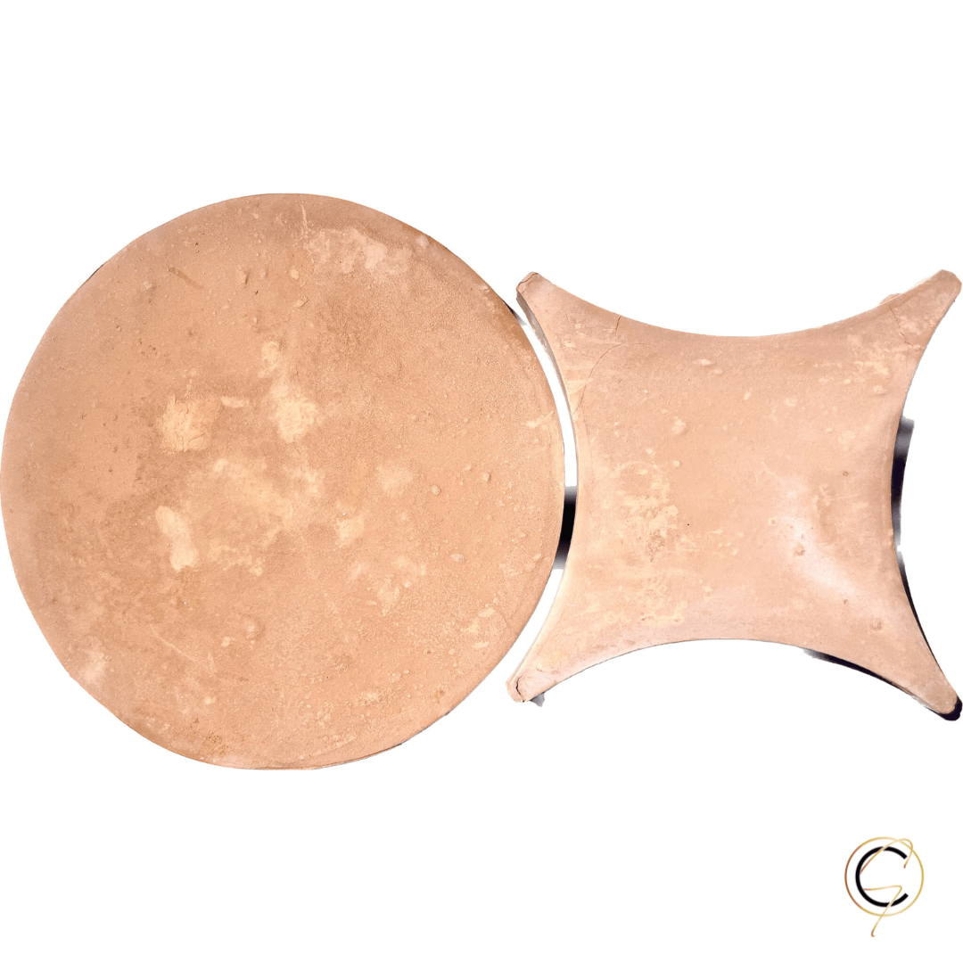 Rustic handmade terracotta floor tile in warm golden-red tones with natural surface variation