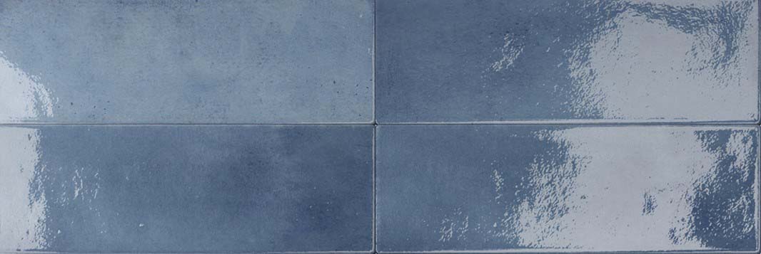 Rich ink blue porcelain tile in gloss finish, 50 × 150 mm, ideal for feature walls