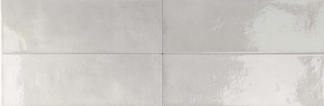 Gloss-finish greige porcelain tile, 50 × 150 mm, with gentle tonal variation