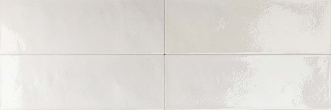 High-gloss white porcelain tile in 50 × 150 mm format with a sleek, reflective surface