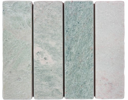 Slim tumbled natural stone batons laid in a soft neutral herringbone pattern, showing subtle surface variation and texture, suitable for indoor or outdoor use.