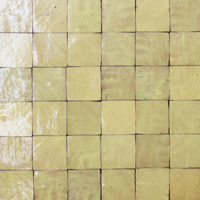 Butter Handmade Moroccan Zellige Tile in 100x100 format featuring warm buttery yellow tones and traditional handmade variation.
